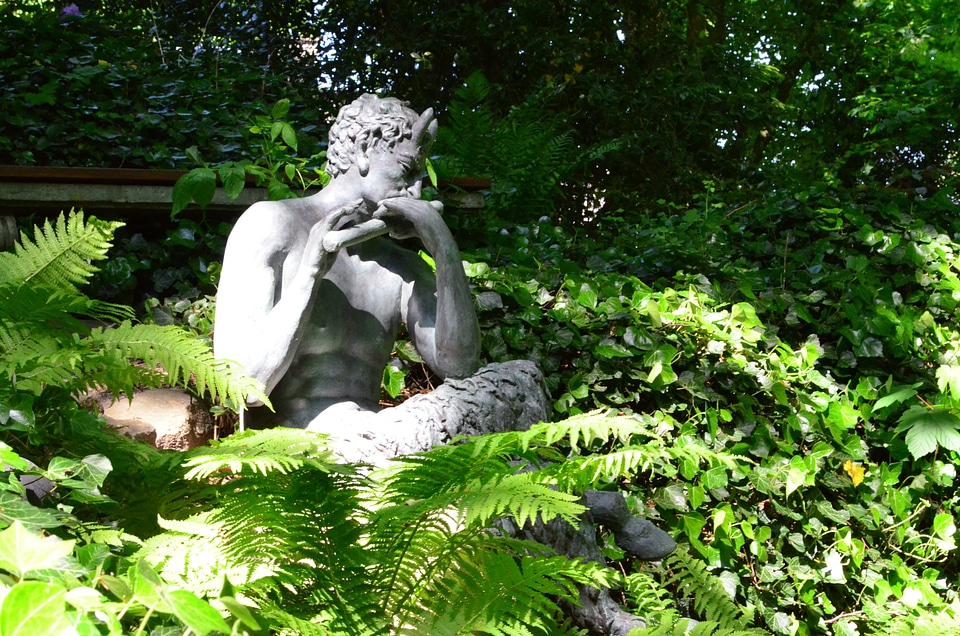 Sculpture mythical creatures figure in the green