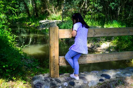 Looking at the water admiring thoughtful landscape photo