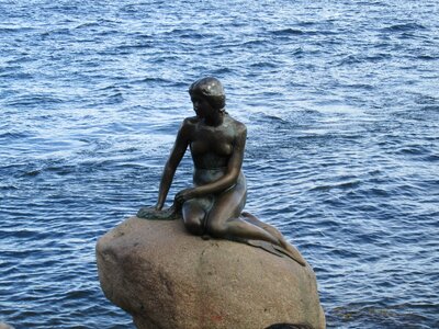 Bronze statue sea woman photo
