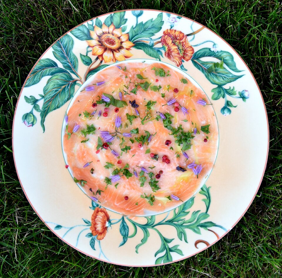 Salmon carpaccio chive flowers entry