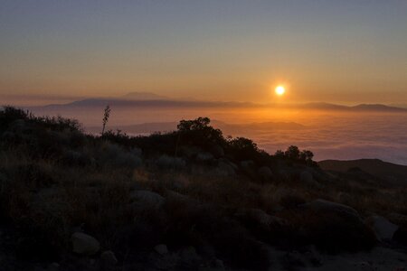 Morning haze cloudy sunrise rocky hills photo