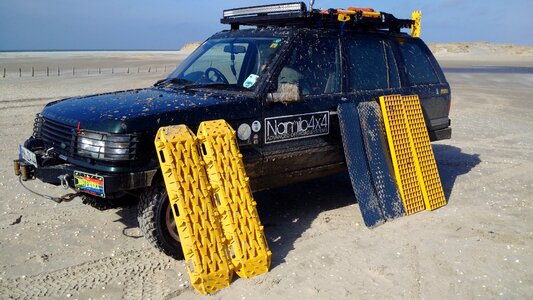 Land rover all terrain vehicle beach photo