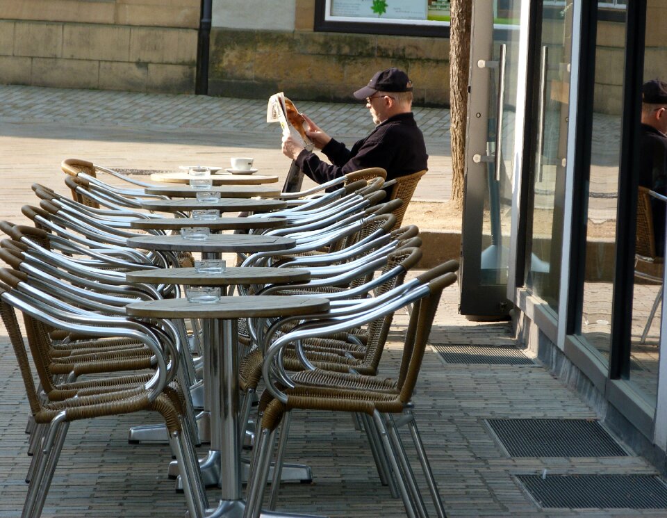 City dining tables newspaper readers