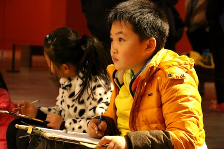 Cute schoolboy painting
