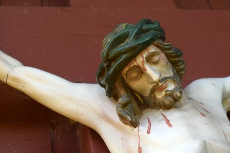 Christ figure wooden cross photo