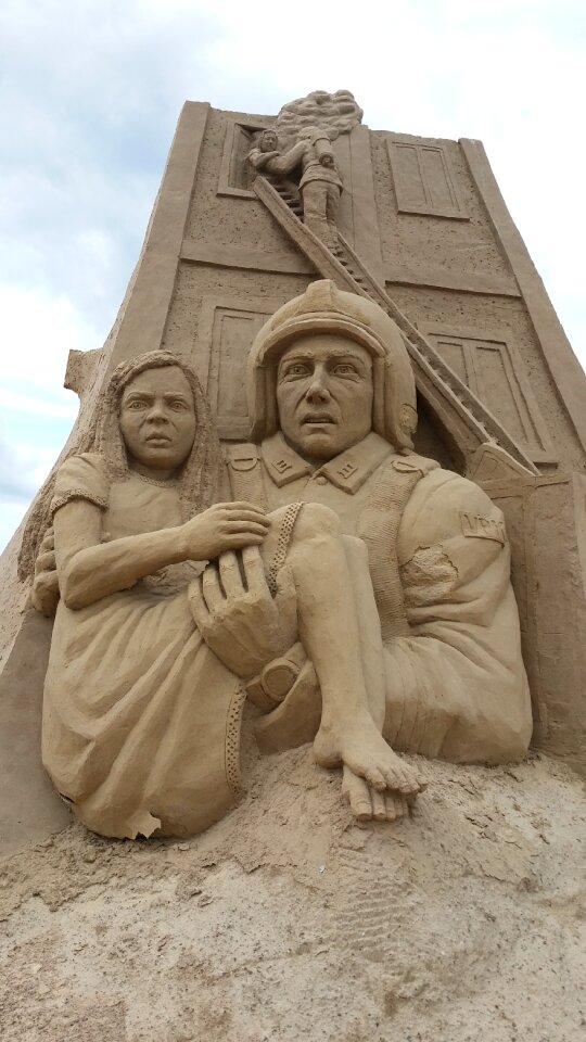 Sand sculpture fire fighter marvel photo