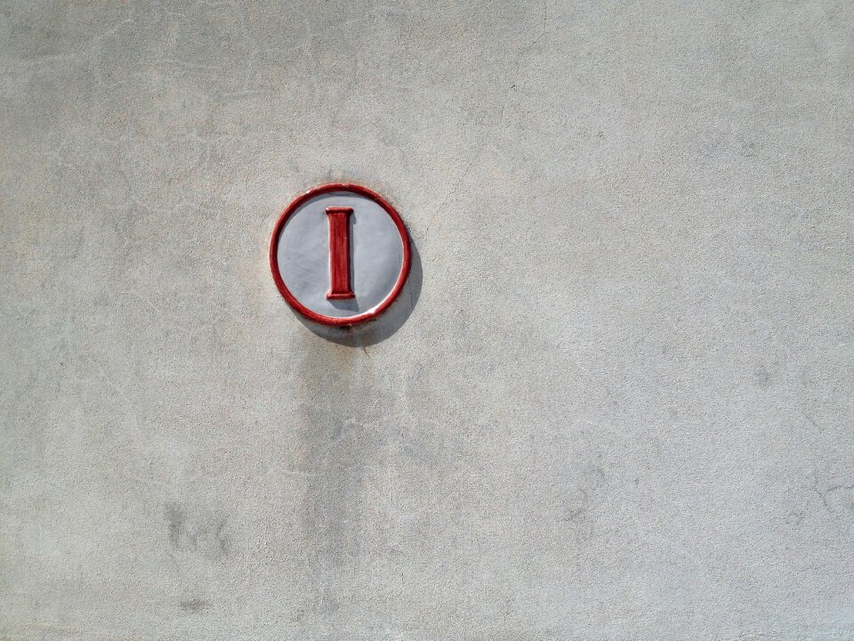 Gray cement sign