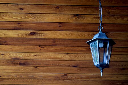 Blockhouse street lamp wooden background