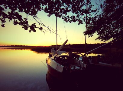 Lake sunset sailboat