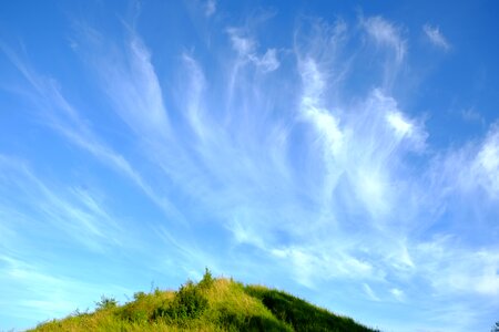 Clouds form landscape hill photo