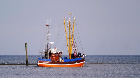 Wadden sea flood fishing vessel photo