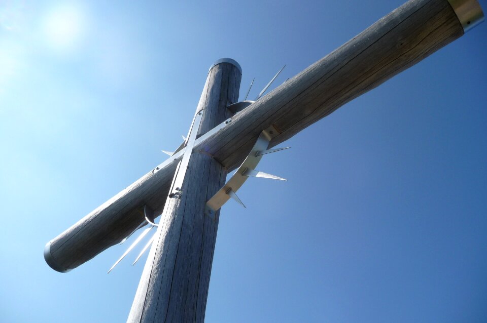 Wooden cross mountain summit of religion photo