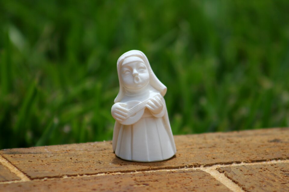 Religious statue green guitar