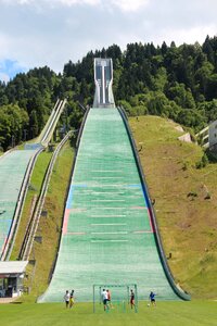 Ski jump football player play soccer