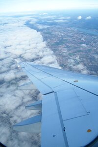 Flying clouds passenger aircraft photo