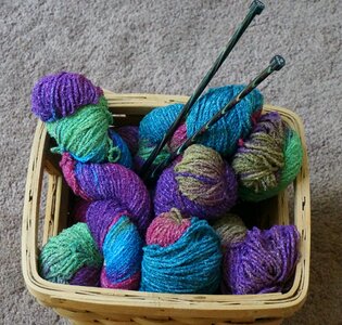 Variegated wool knitting needles photo