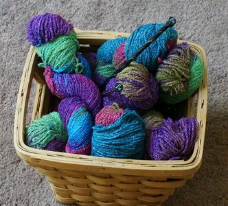 Variegated wool knitting needles photo