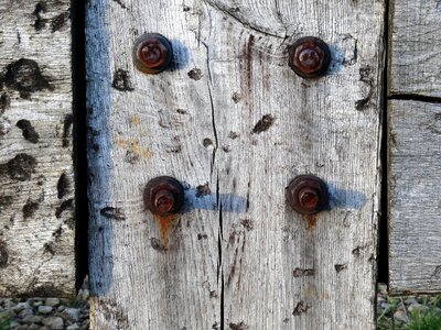 Aged wood rusted bolts assembling wood and iron