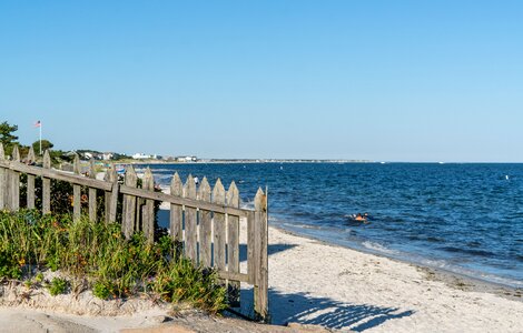 Beach fence sand