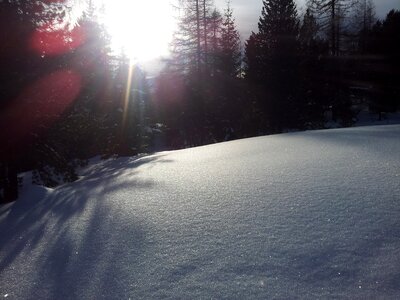 Backlighting snowy sun