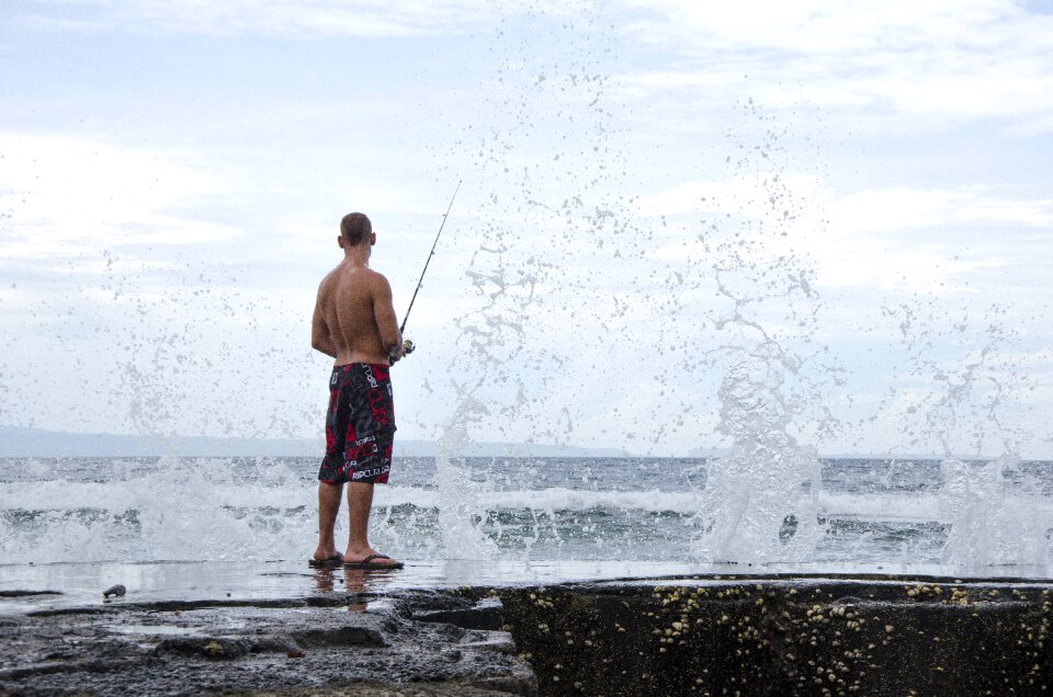 Man swimming trunks fish