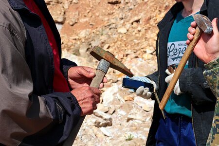 Rock hammer hold hands photo