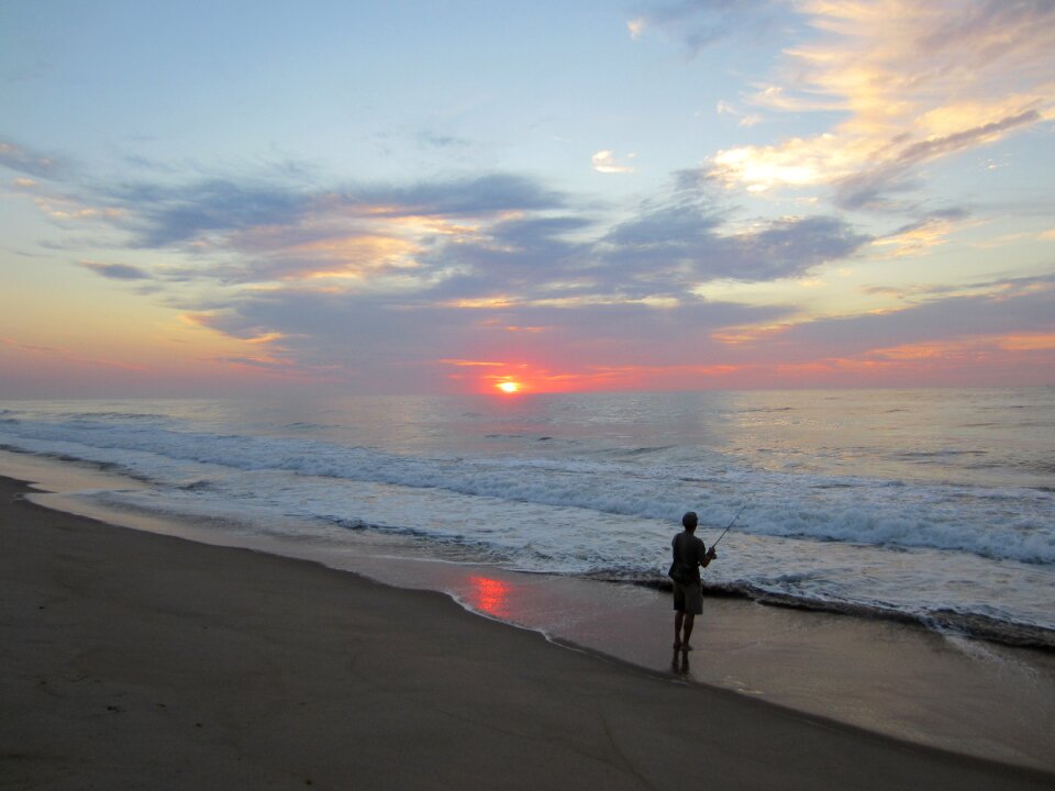 Surf fishing pole fisherman