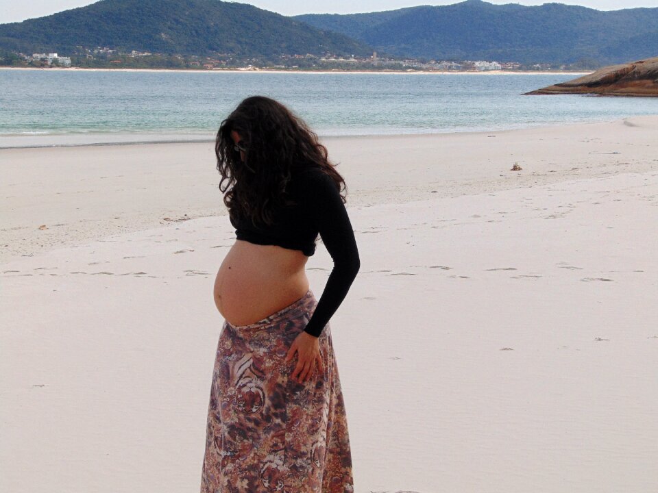 Pregnant woman beach mar