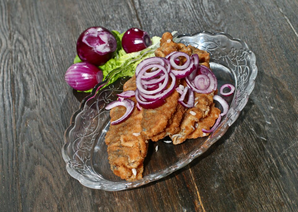 Fried herring in brine red onion salad