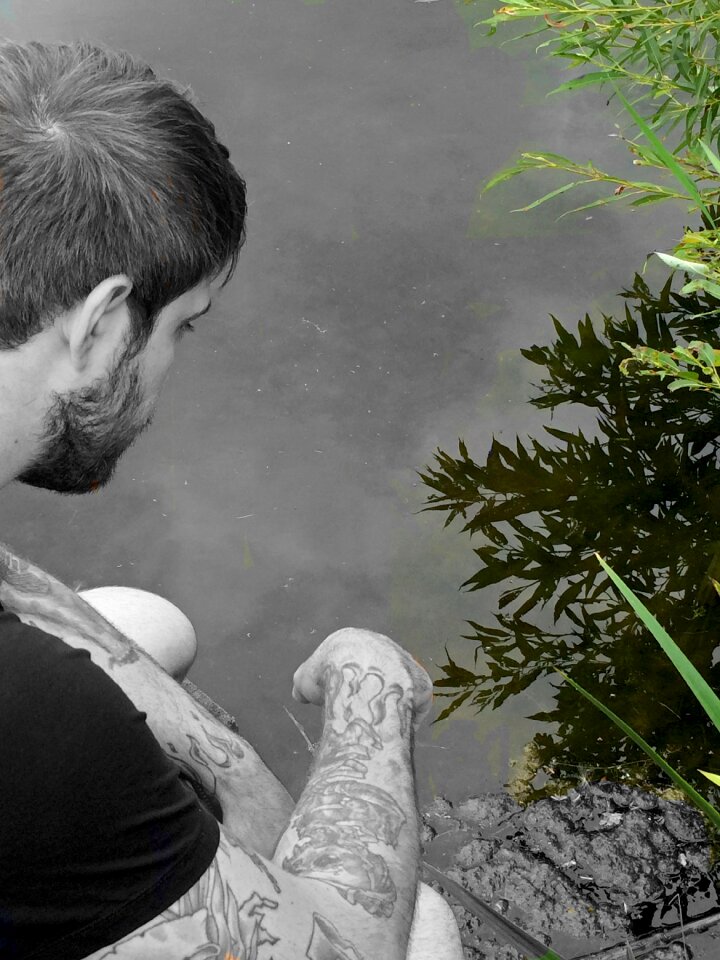 Man pond sitting