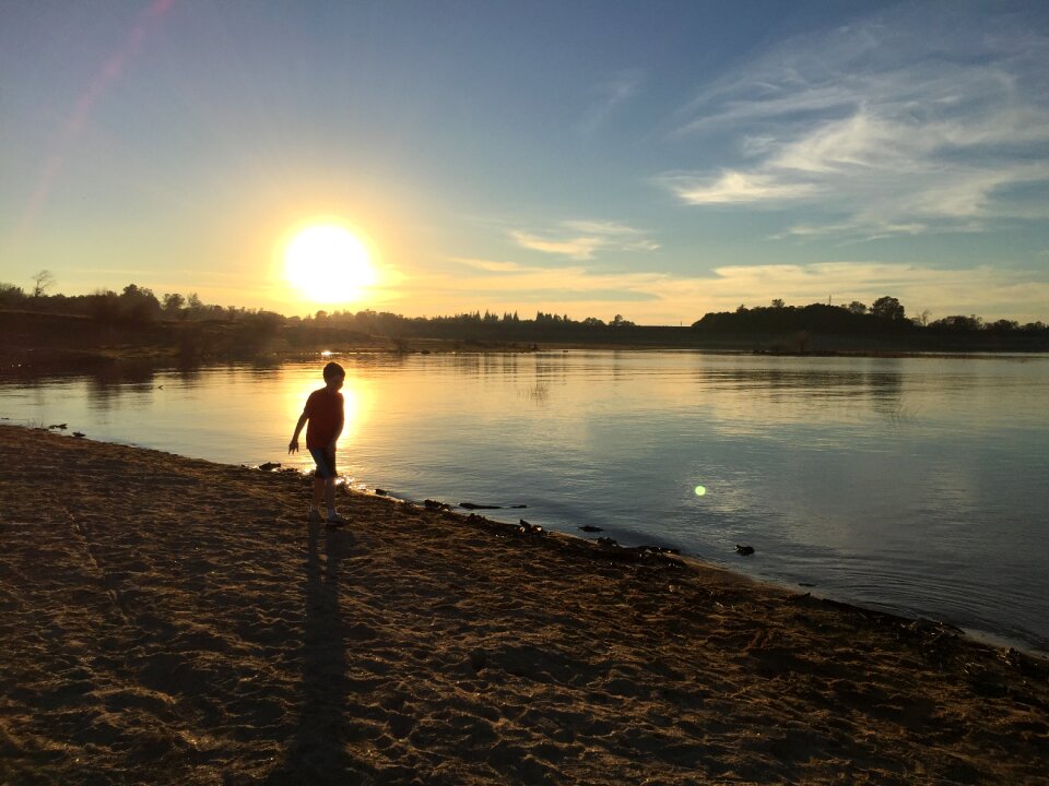 Boy silhouette beach
