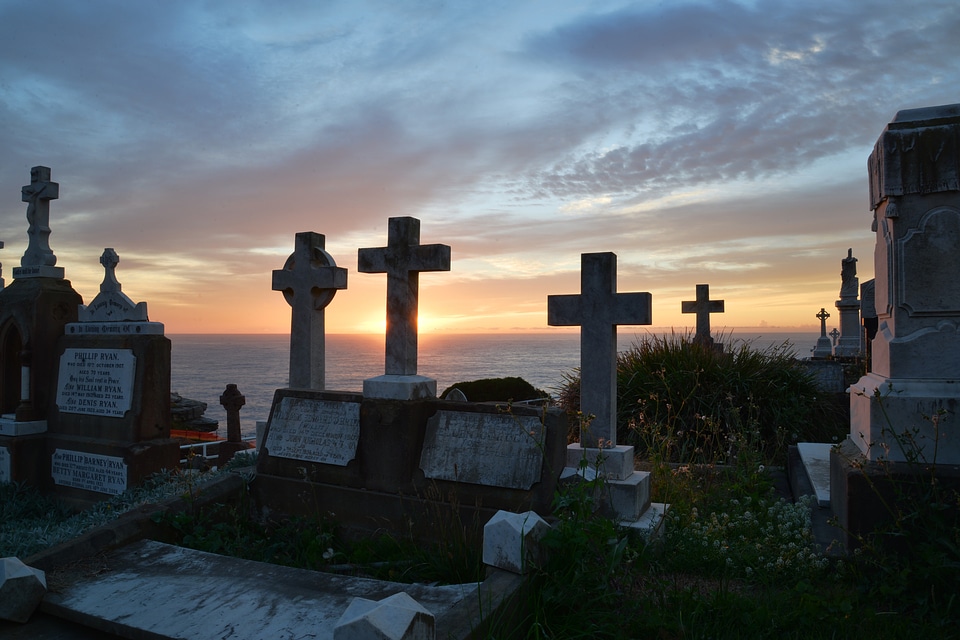 Gravestone cross sunrise
