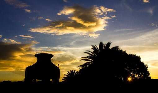 Indian tinaja against light sunset