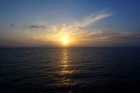 Sunrise over the sea water reflection