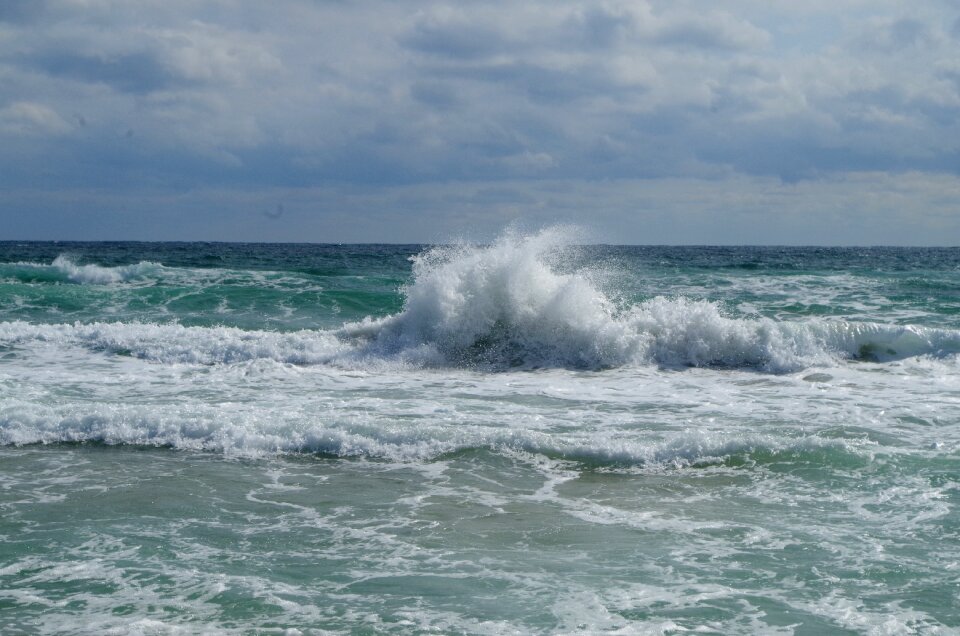 Sea foam clouds waves