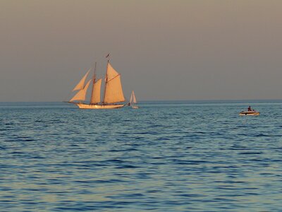 Evening sky sailing boat sea photo