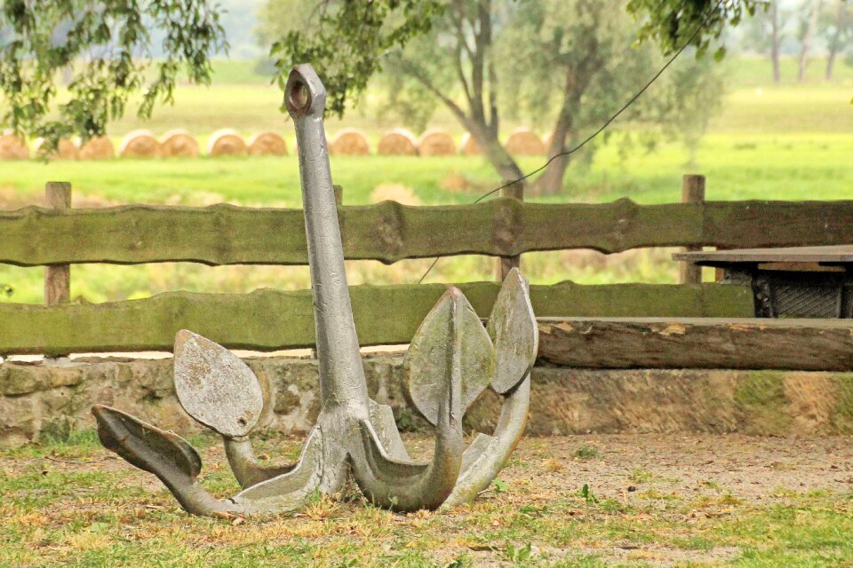 Anchor plank fence straw bales