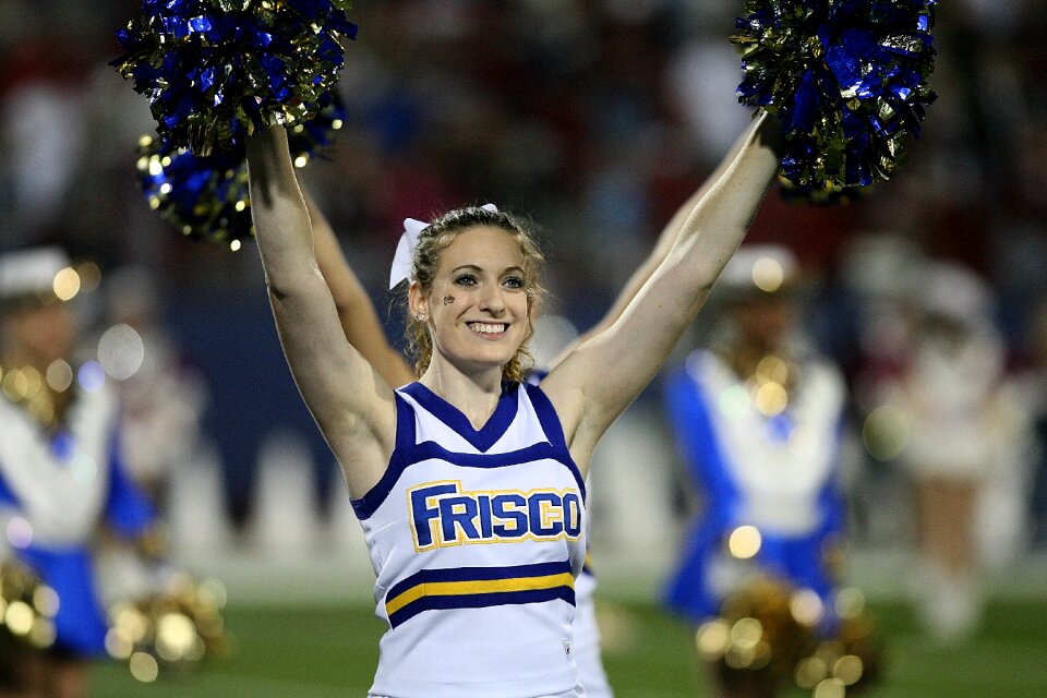 Female teenager cheerleading