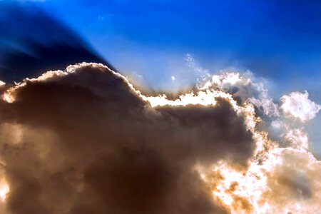 Bright cloud clouds form sunbeam photo
