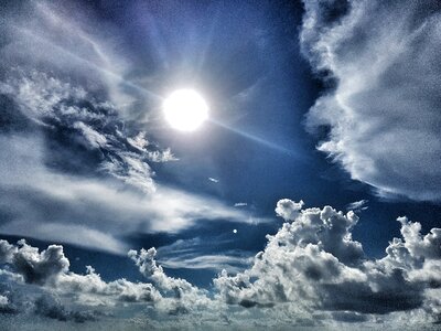 Clouds blue sky sun photo