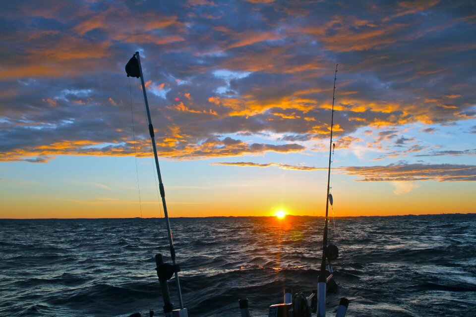 Clouds fishing poles fish