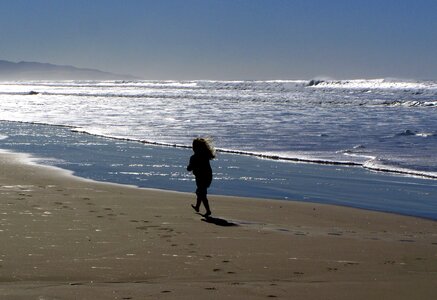 Child sand sea ​​waves photo