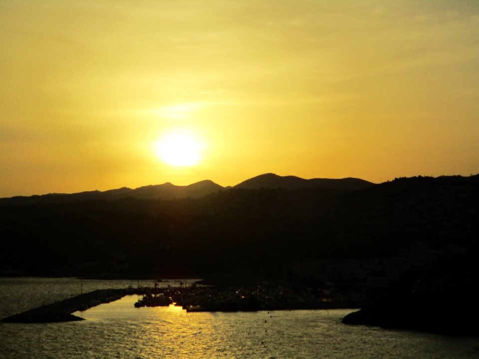 Setting sun colorful sunset water