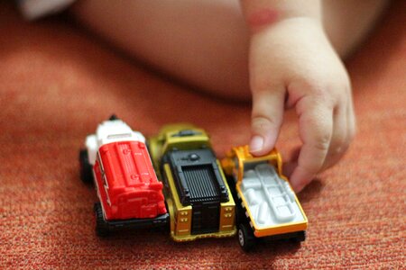 Toy car child's hand game photo