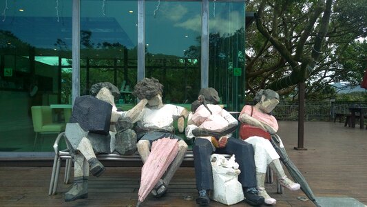 Wood carving titer people