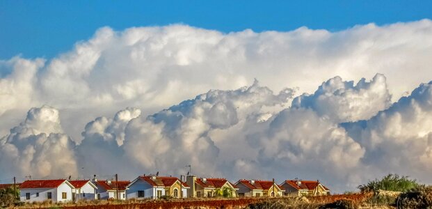 Houses clouds dramatic photo