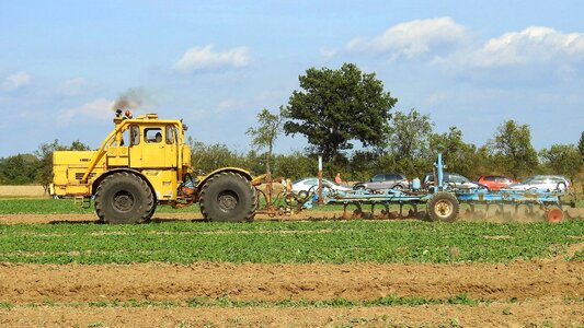 Tractor field ploughing