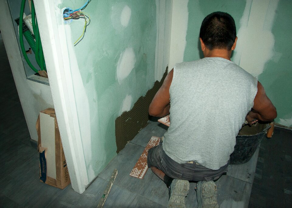 Mosaic tile worker