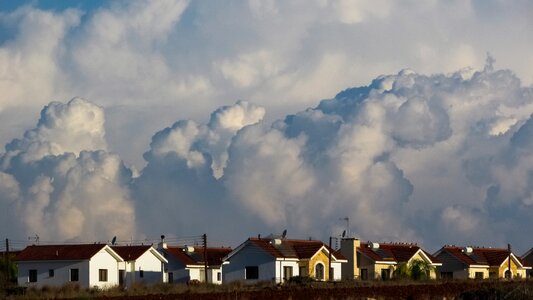 Houses clouds dramatic photo