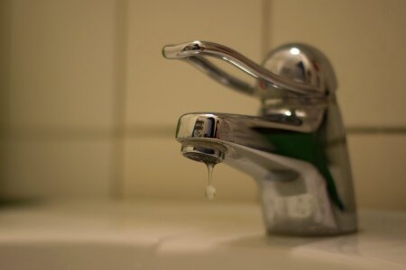 Water bathroom faucet dripping tap